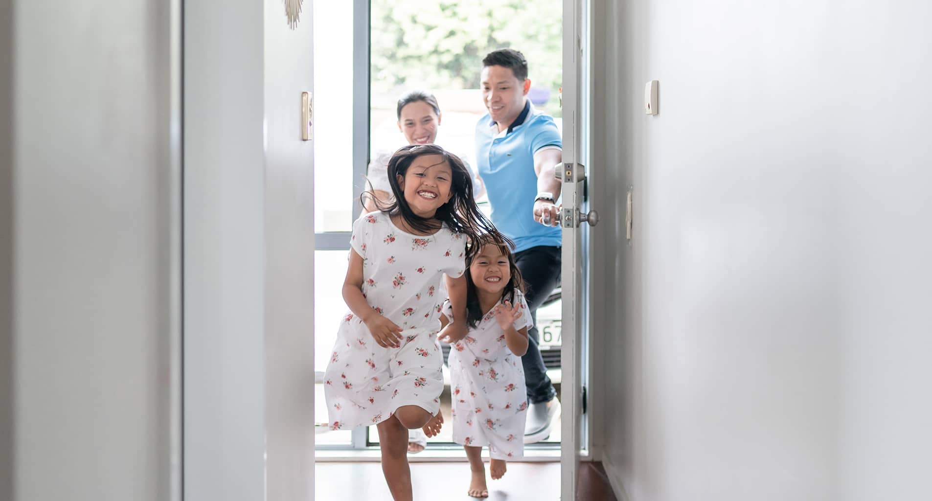 family running into new home