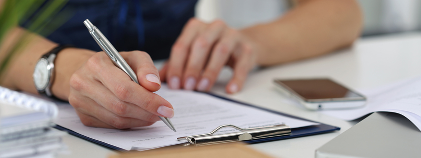 Person using checklist for personal assets and income verification documents